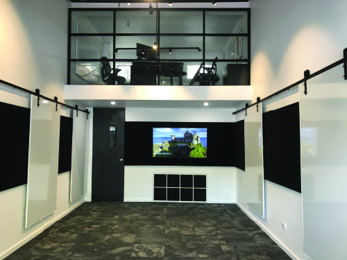 - Luxury Linings Modern commercial plastering by Luxury Linings in an office space with a mezzanine and smooth, white walls.